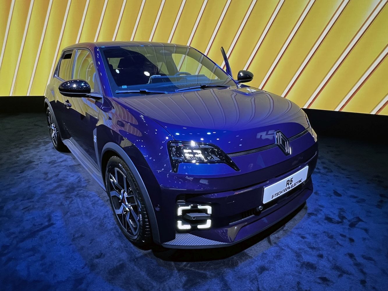 Front view of compact electric hatchback with modern LED headlights