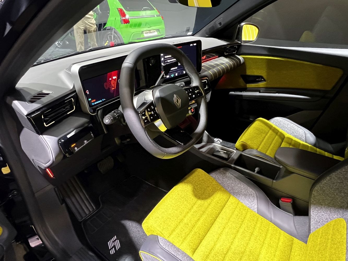 Digital instrument cluster and sporty seats with vibrant color accents