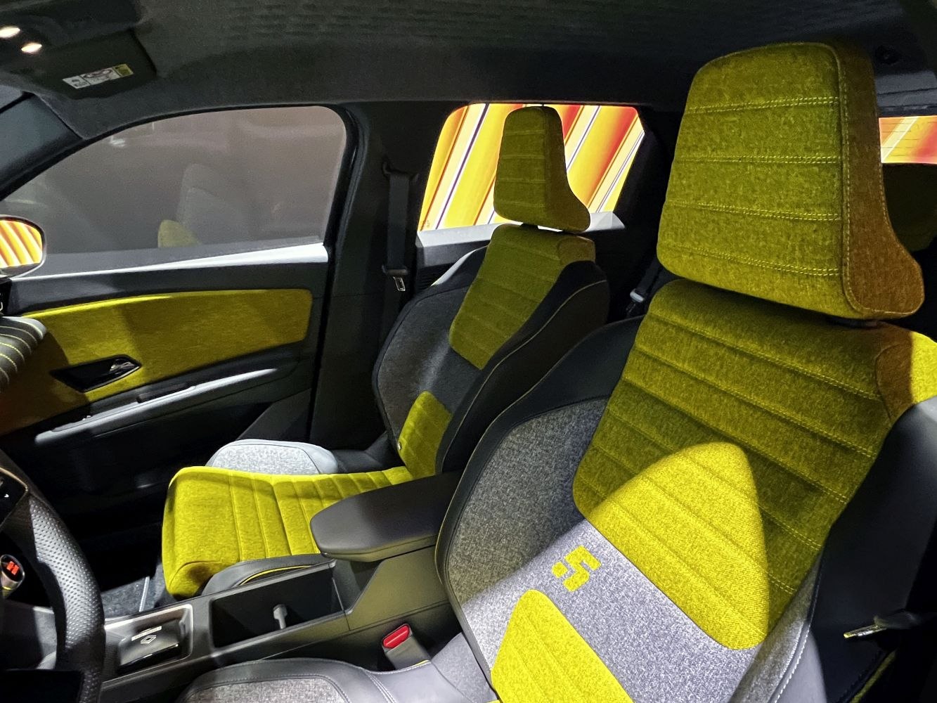Yellow and grey fabric front seats with front armrest and door fabric panel