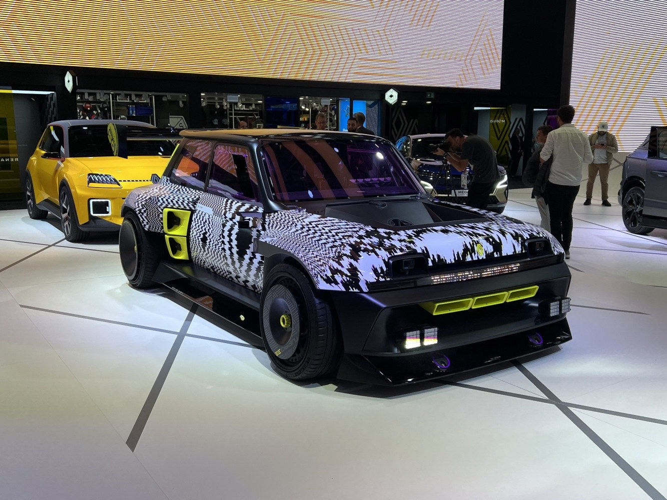 Wide-body concept with digital camo wrap and neon yellow accents