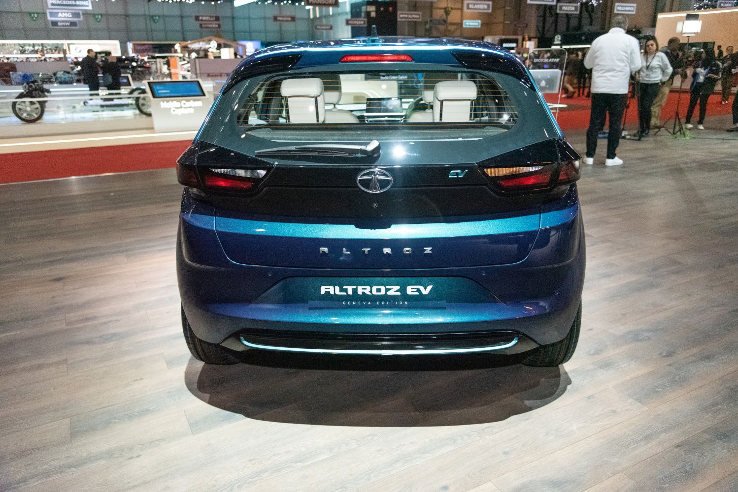 Rear view of hatchback with EV badge and modern taillights