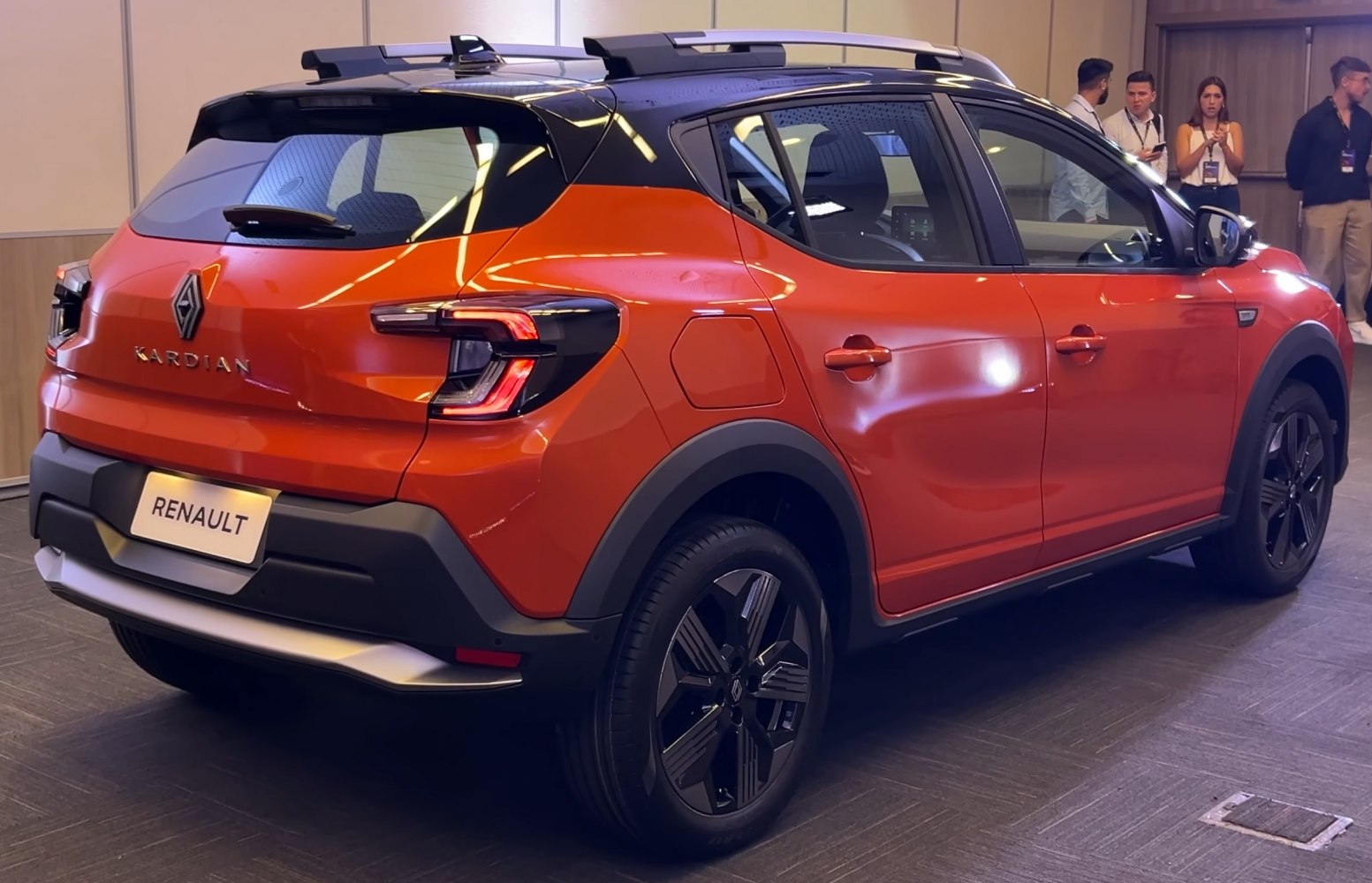 SUV rear and side view with modern taillights and two-tone orange-black paint