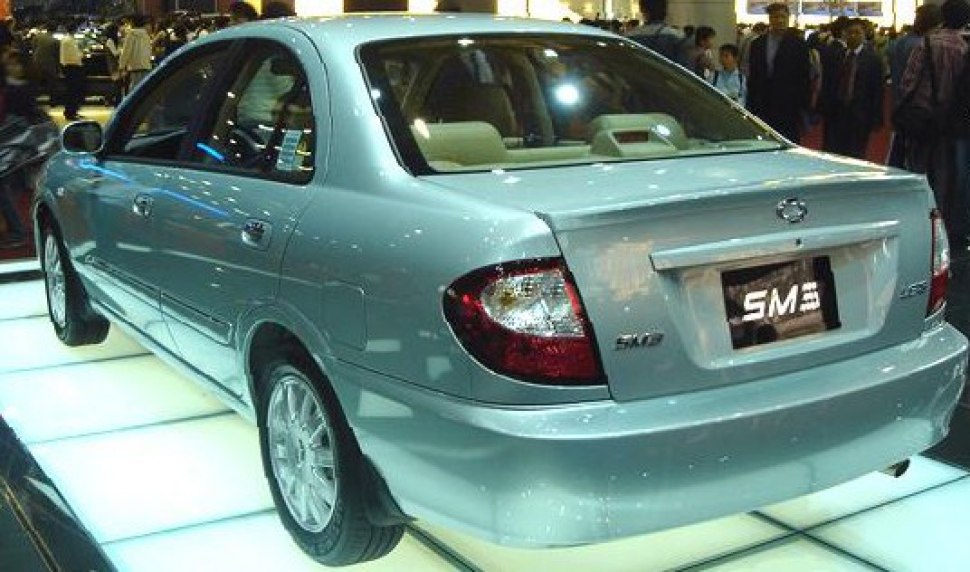 Rear exterior and tail light view of a sedan model.