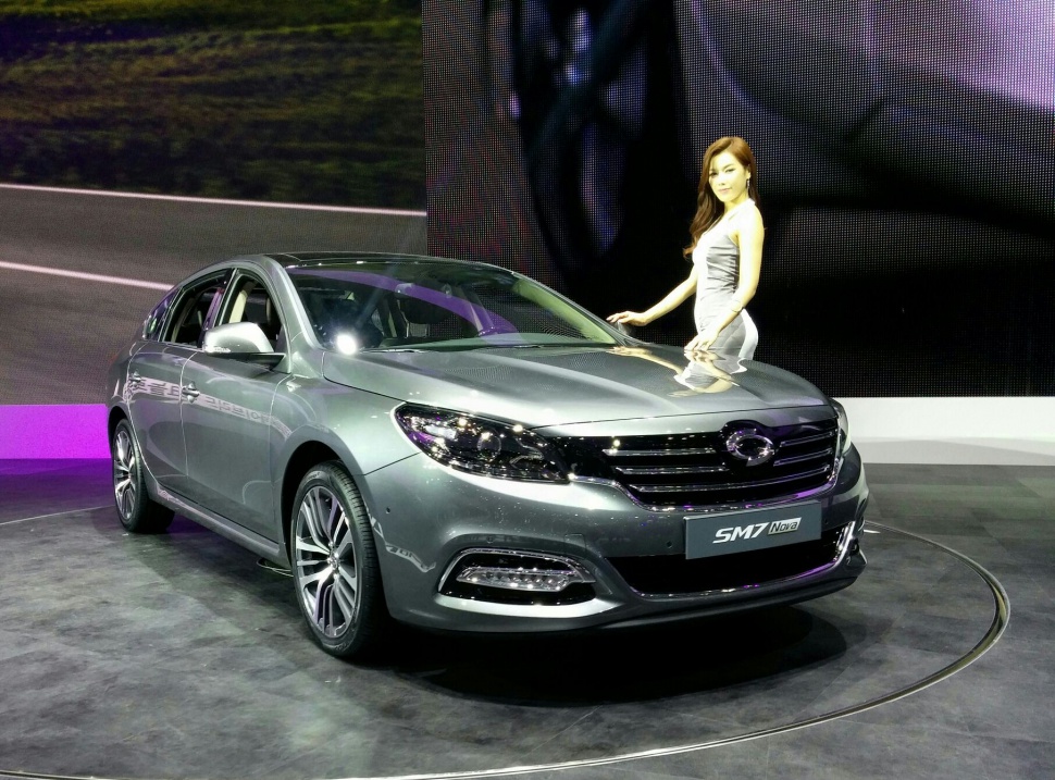 Silver sedan with prominent front grille and LED daytime running lights