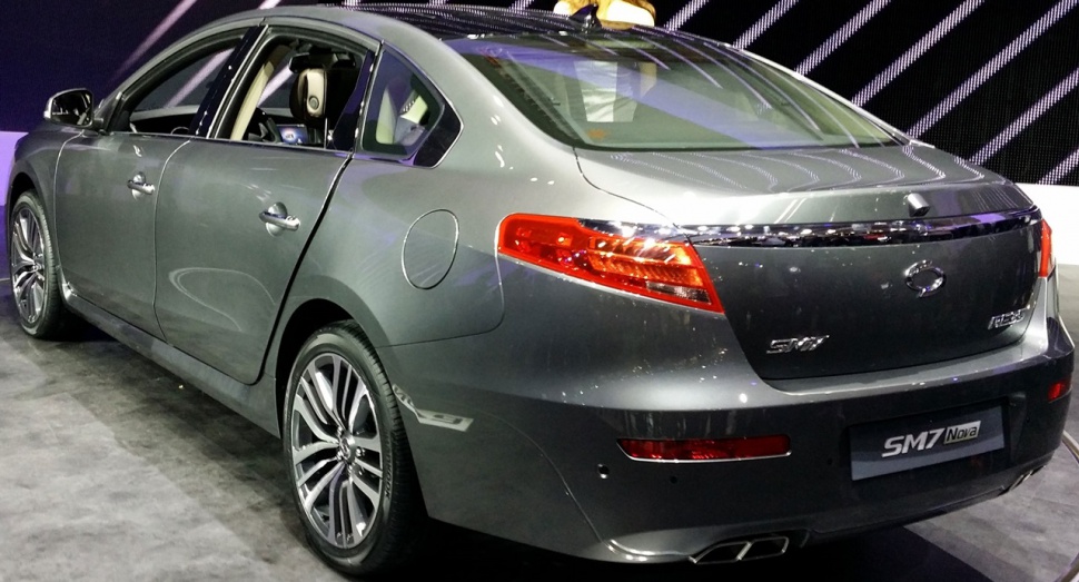 Rear view of mid-size sedan with distinctive tail lights and dual exhaust tips