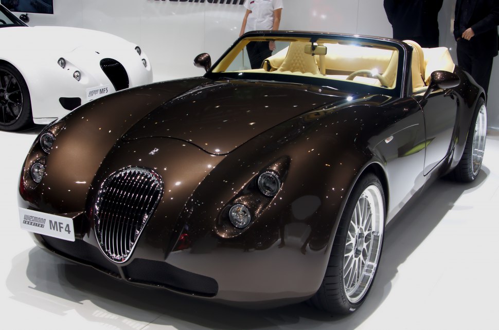 Convertible roadster with unique oval grille and round quad headlights