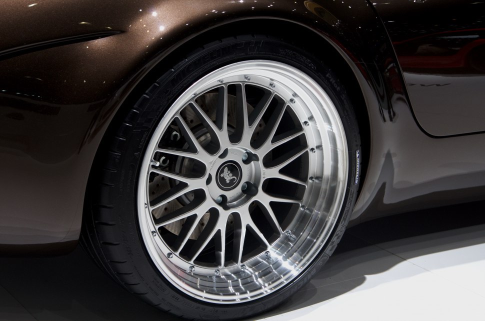 Detailed alloy wheel and tire with visible brake disc