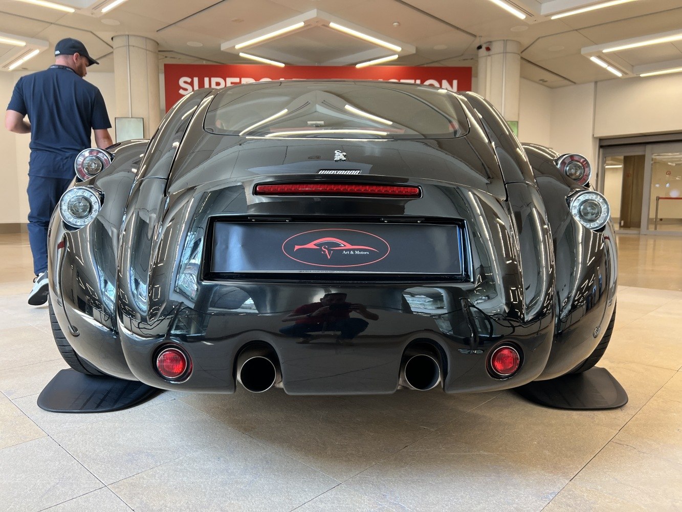 Curved rear end with distinctive taillights and dual exhaust pipes