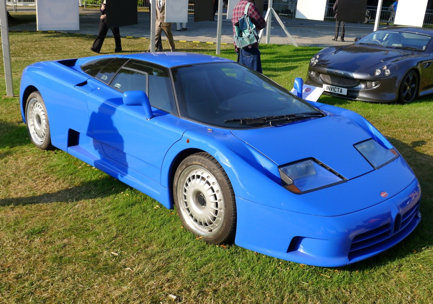 Blue sports coupe with pop-up headlights and aerodynamic styling