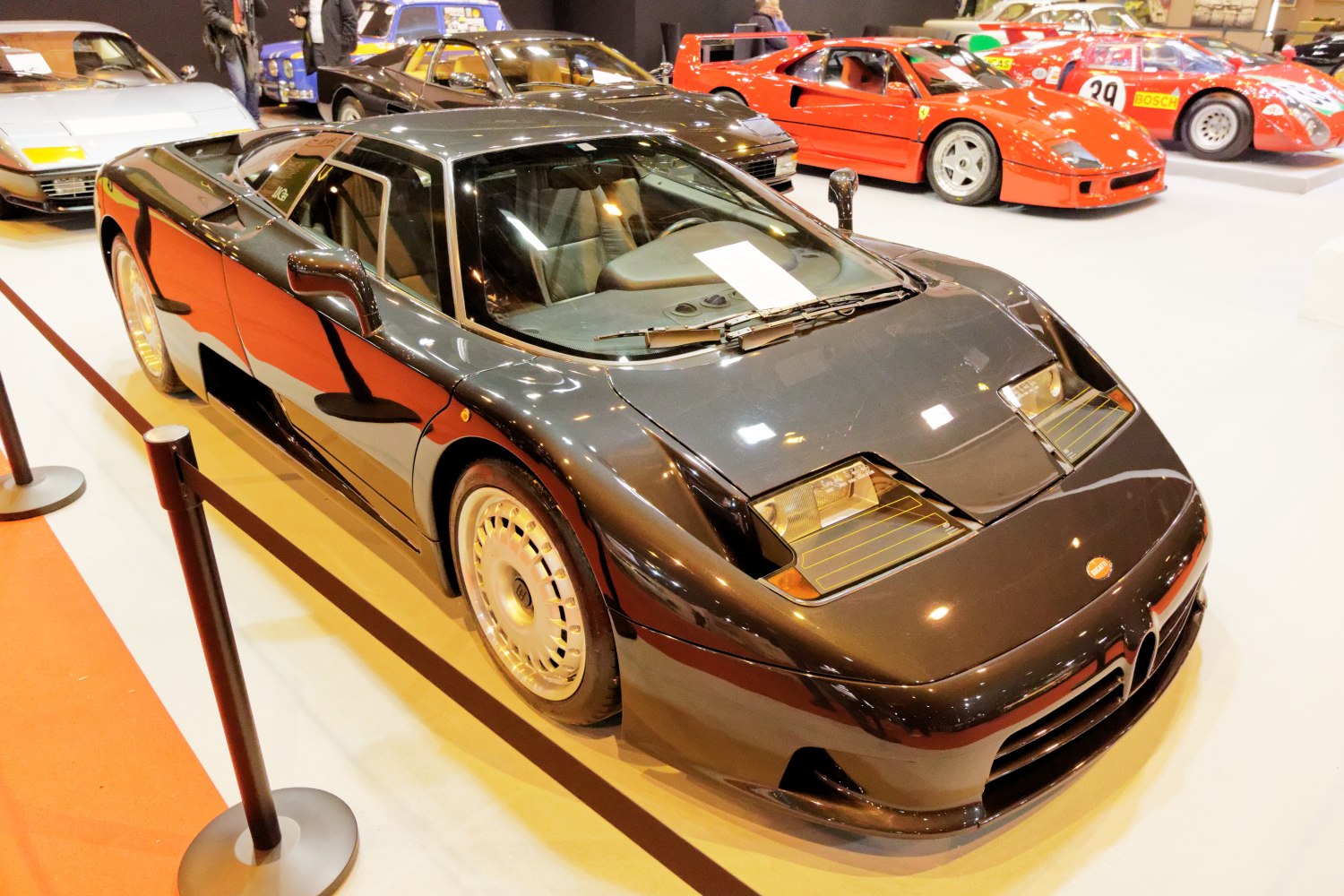 Mid-engine sports car with pop-up headlights and sleek aerodynamic body