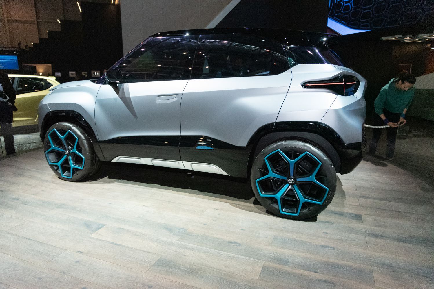 Side profile with futuristic star-patterned blue-accent wheels