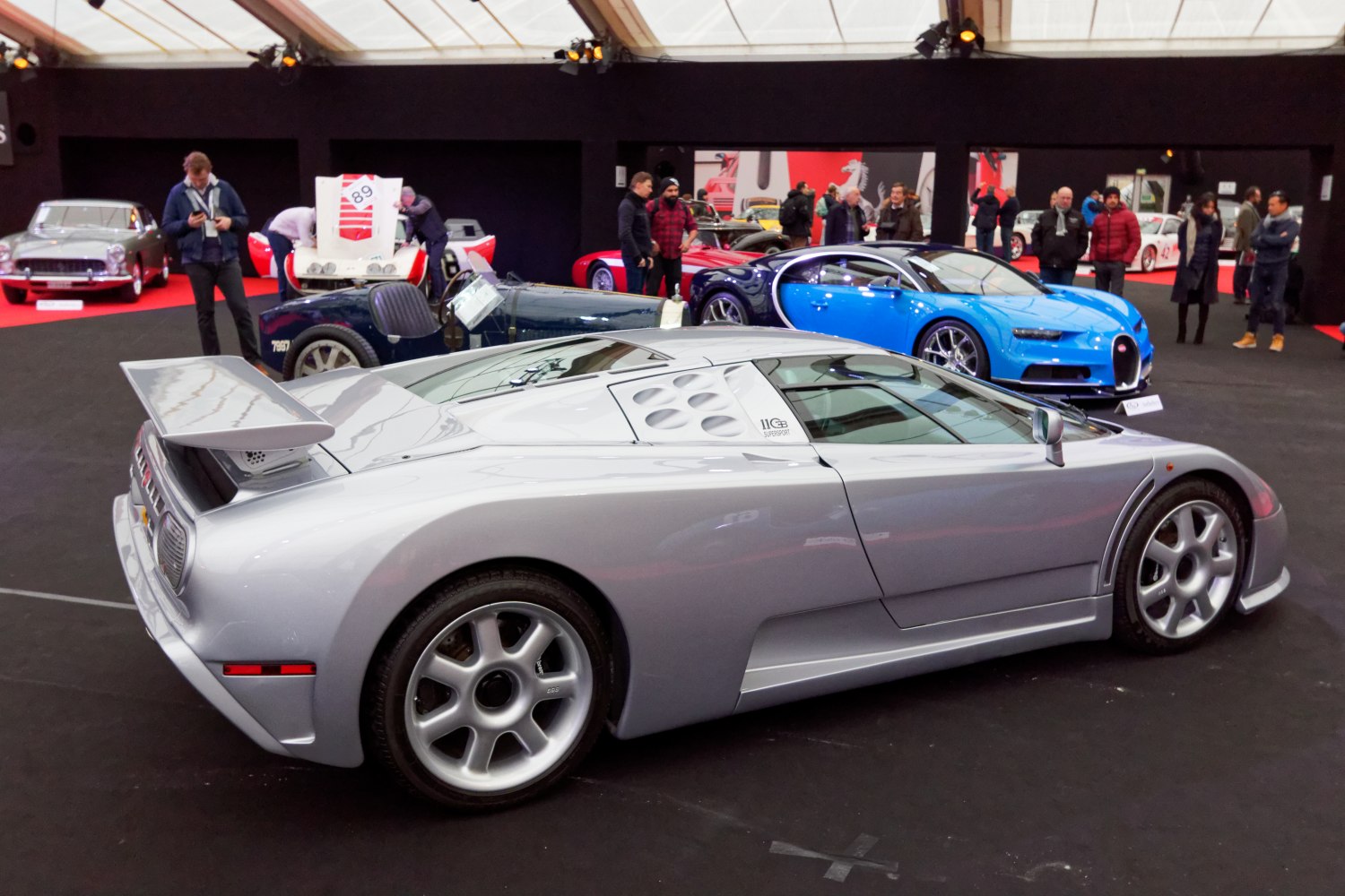 Silver sports car with rear spoiler and distinctive side air vents
