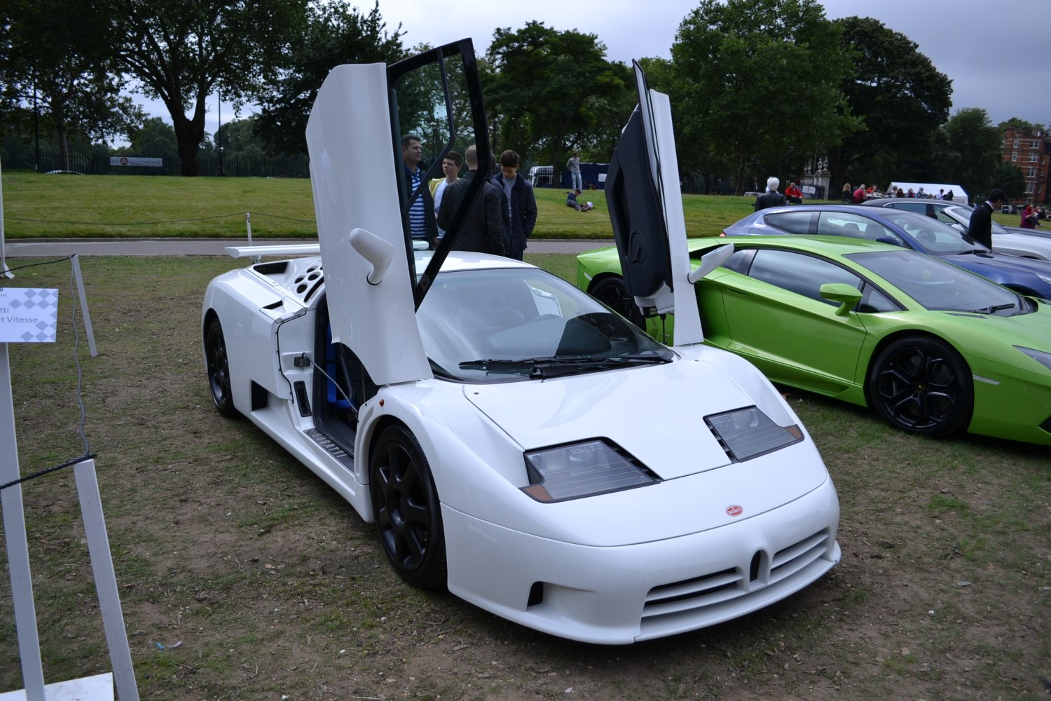 White sportscar with gull-wing doors and angular headlights