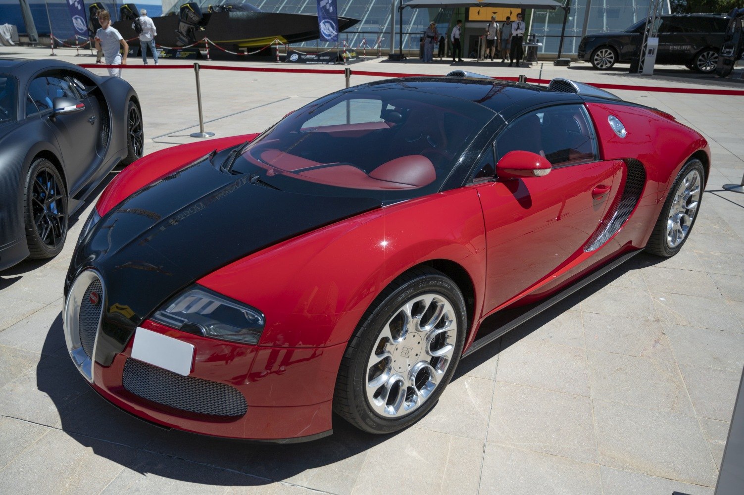 Red and black luxury sports car with aerodynamic design and special wheels