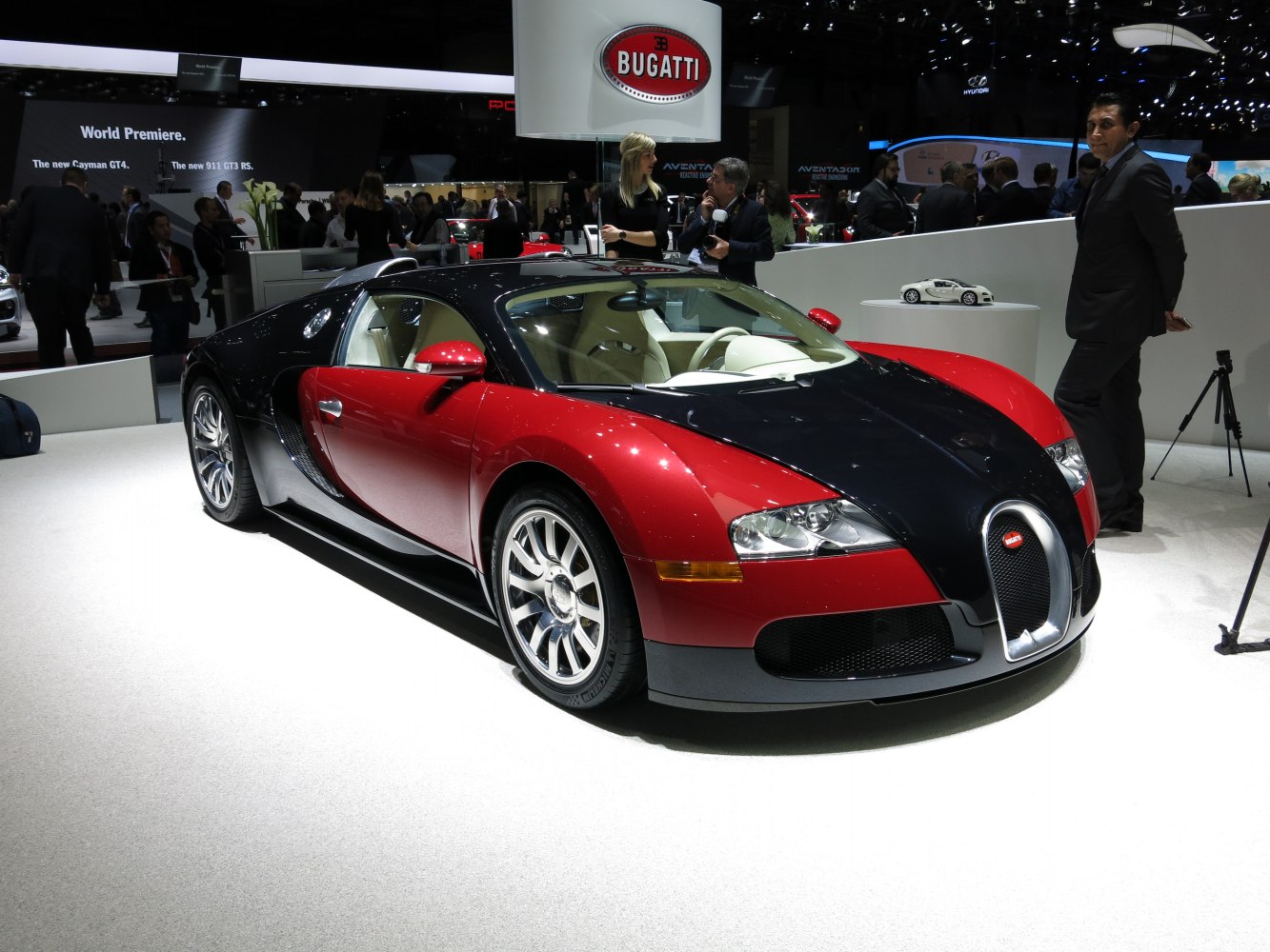 Red and black coupe with chrome wheels and aerodynamic design
