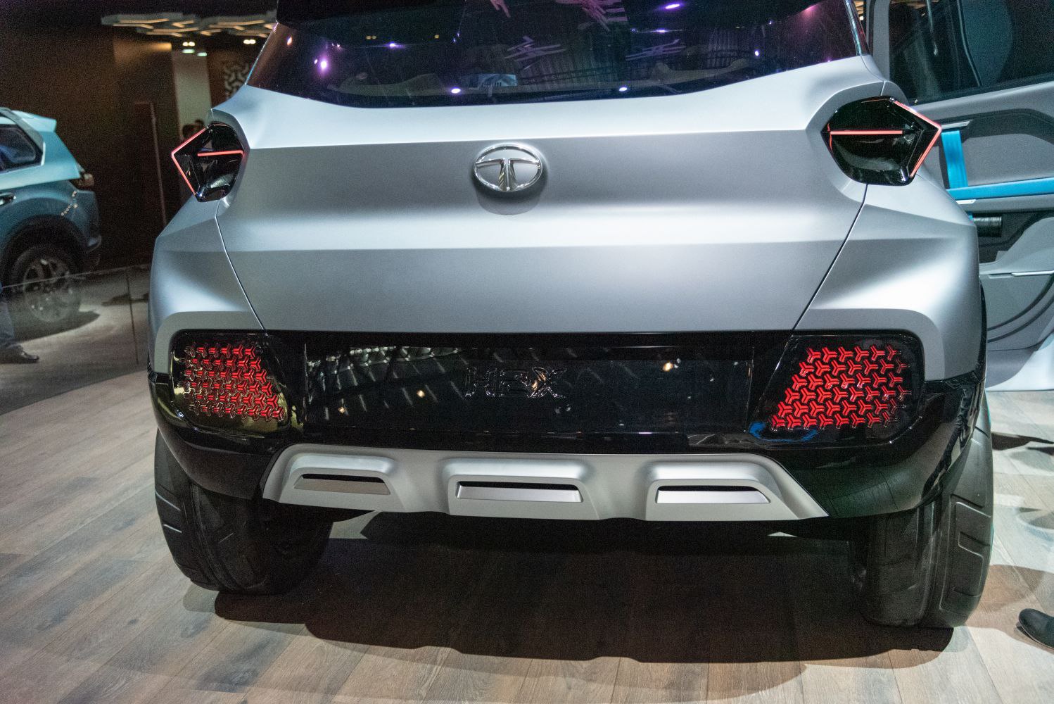 Close-up of futuristic rear design with hexagonal-pattern tail lights and bold bumper.