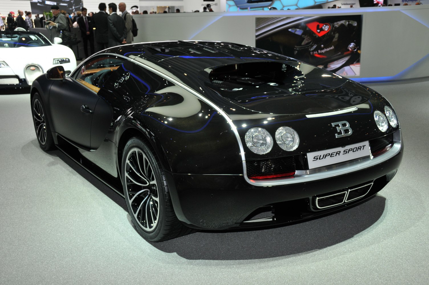 Rear view of sleek Bugatti Veyron Coupe showing taillights and aerodynamic shape