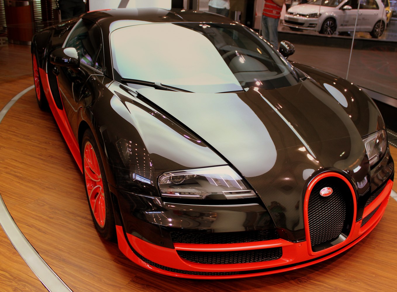 Carbon fiber front with red accents and aerodynamic design