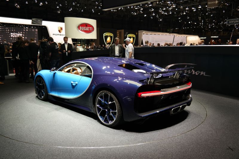 Rear view of blue Bugatti Chiron with aerodynamic design and performance wheels