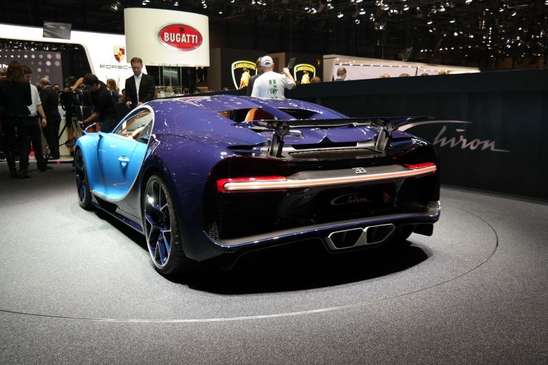 Rear view of a sports car with an extended rear spoiler and distinctive lighting