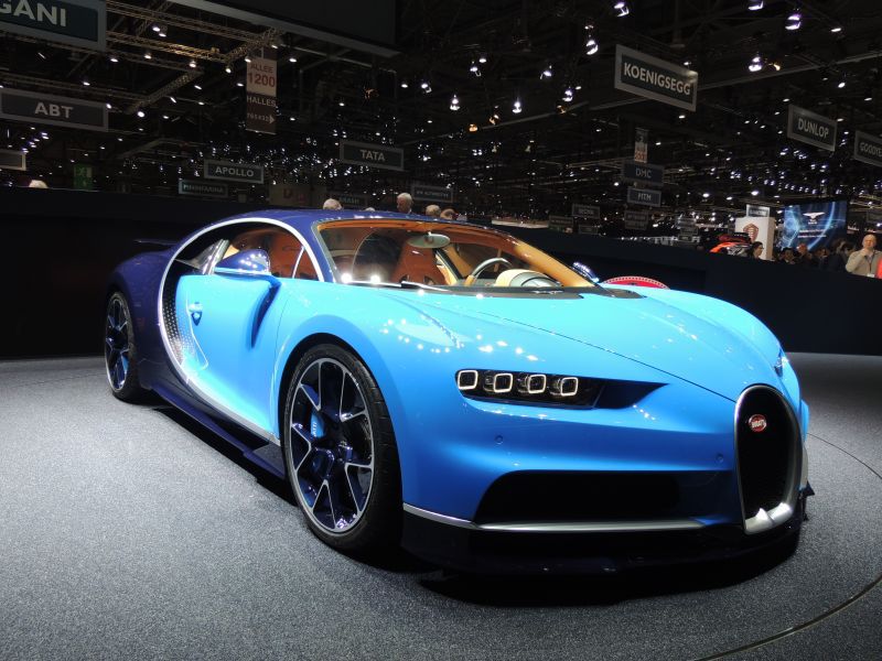 Blue supercar with quad LED headlights and aerodynamic body