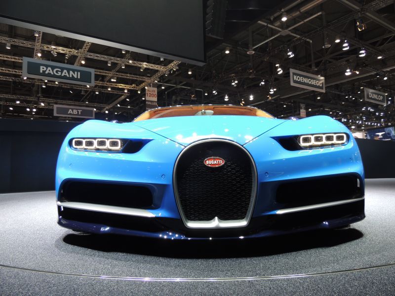 Front view with iconic horseshoe grille and quad LED headlights in blue.