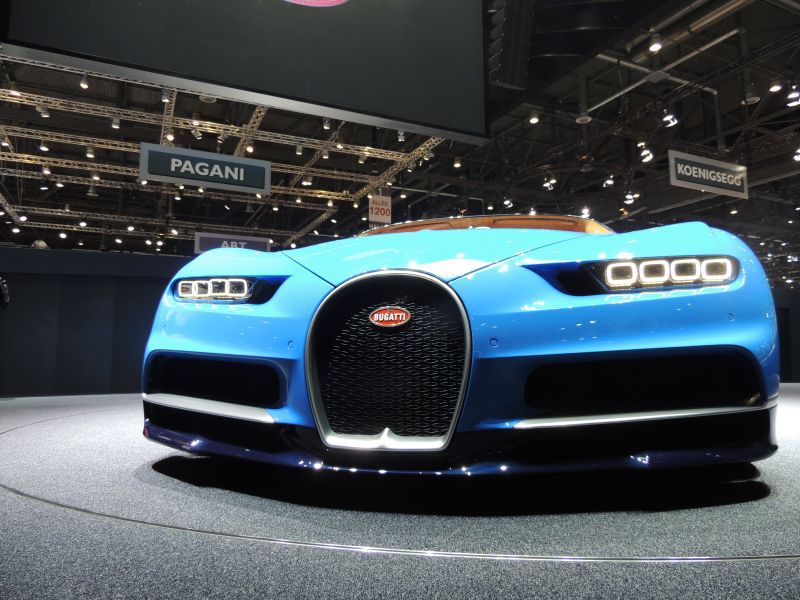 Front view of a sports car with horseshoe grille and quad LED headlights.