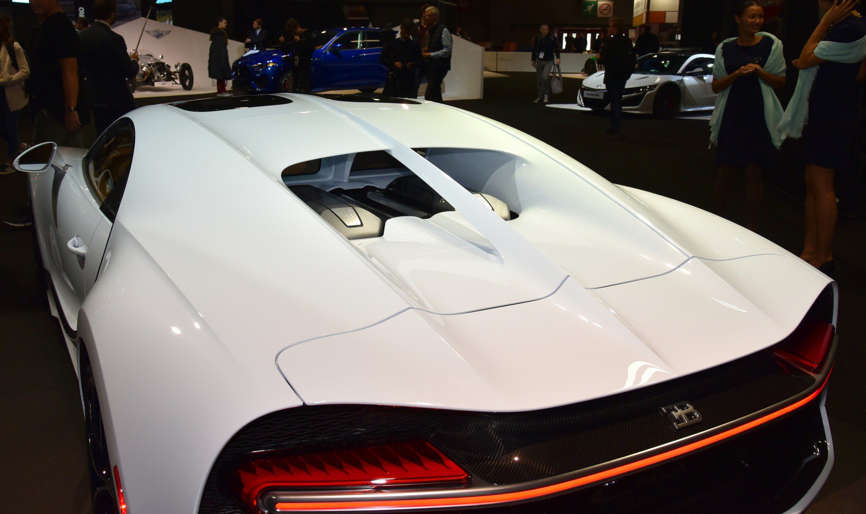 Close-up of rear engine cover and LED taillight strip with aerodynamic design