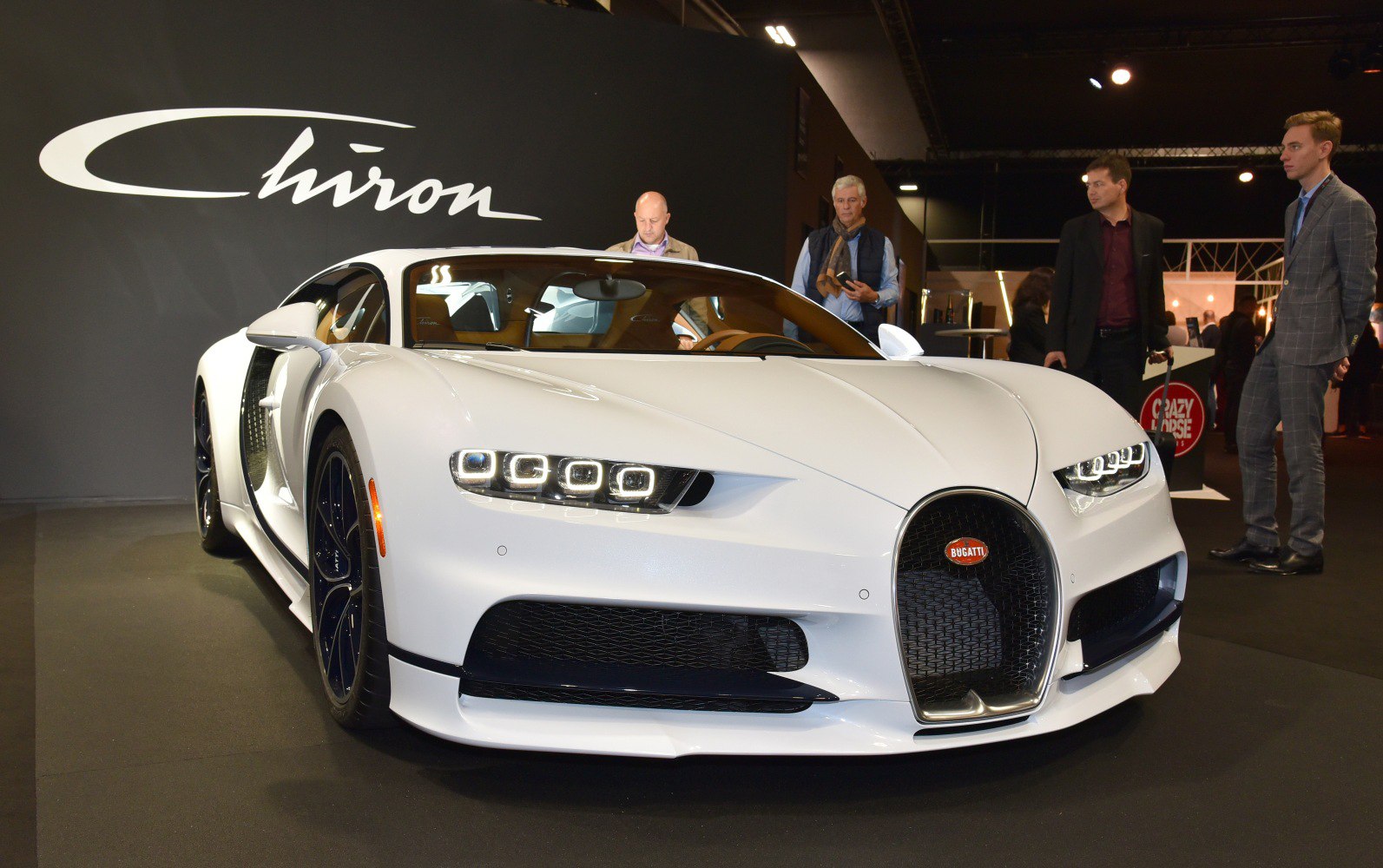 White sports car front with LED headlights and horseshoe grille