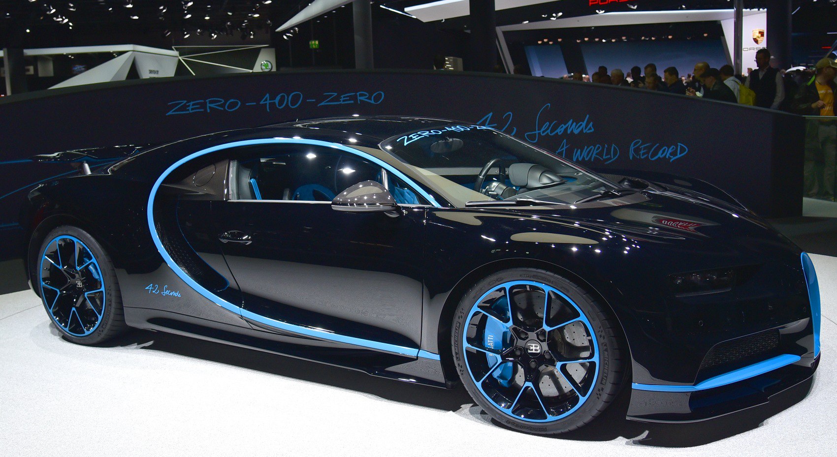 Black sports car with blue accents and aerodynamic curves