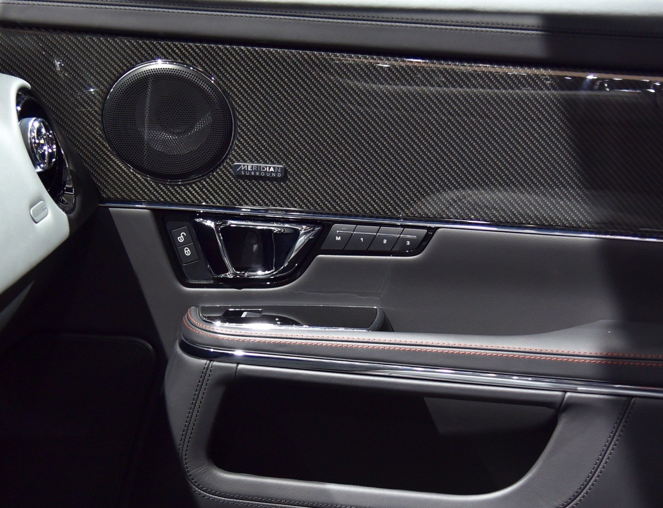 Carbon fiber trim door panel with Meridian speaker and memory seat controls