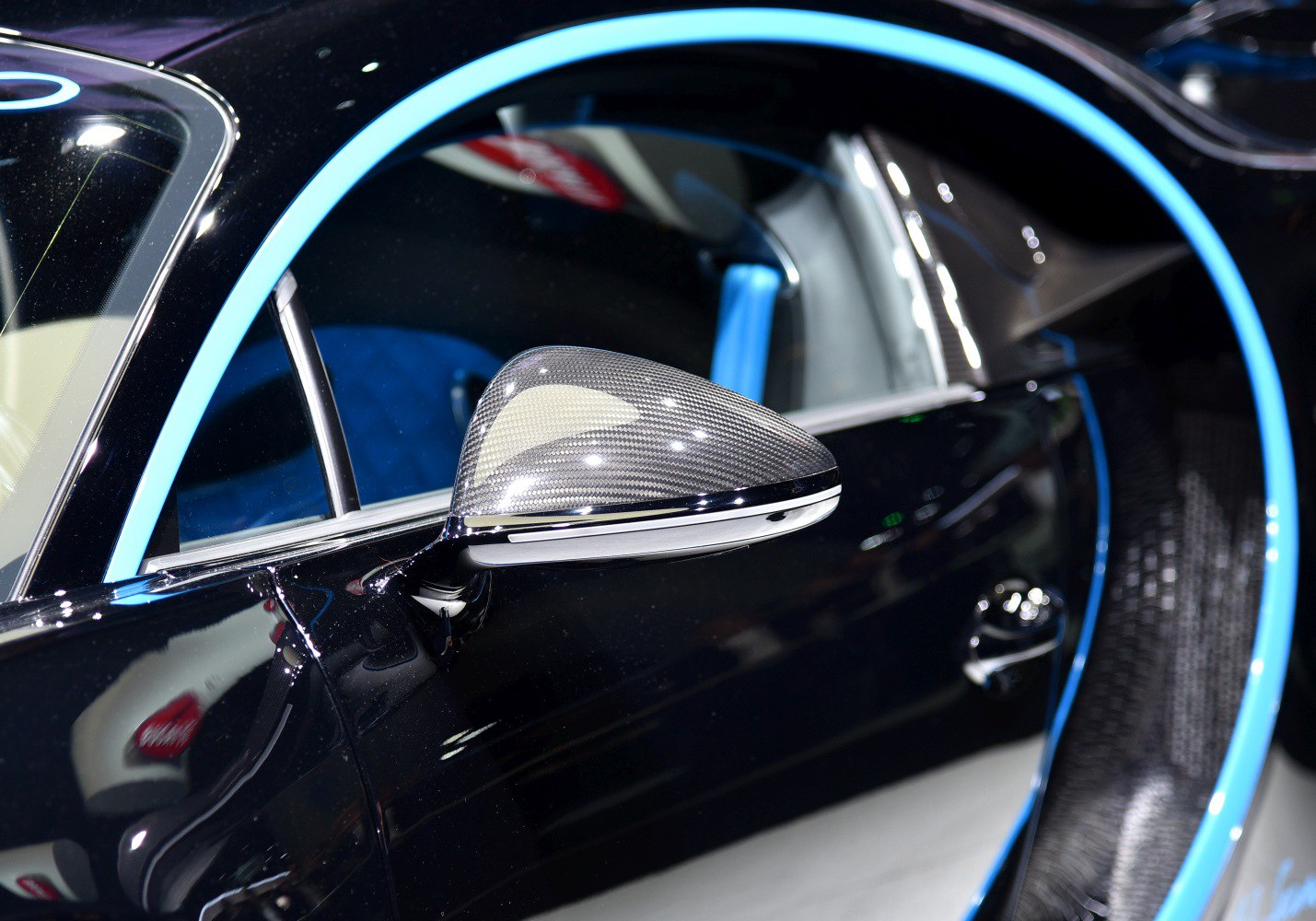 Carbon fiber side mirror and blue door frame detail