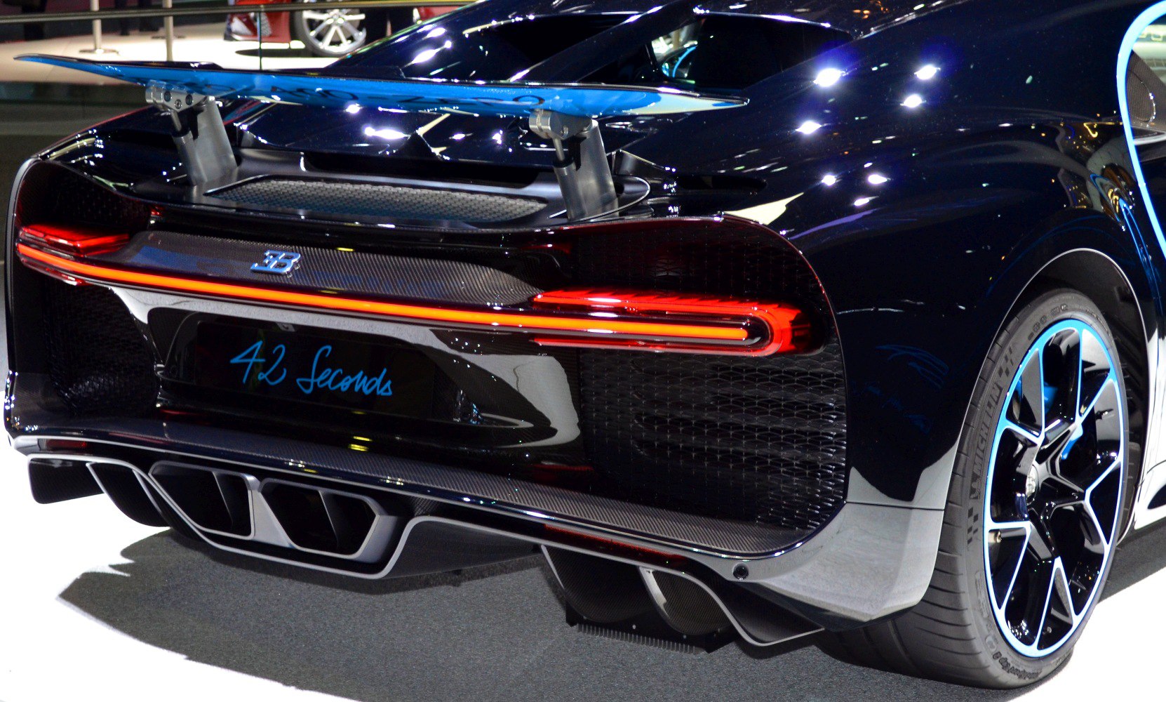 Active rear spoiler with LED tail light and unique exhaust outlet