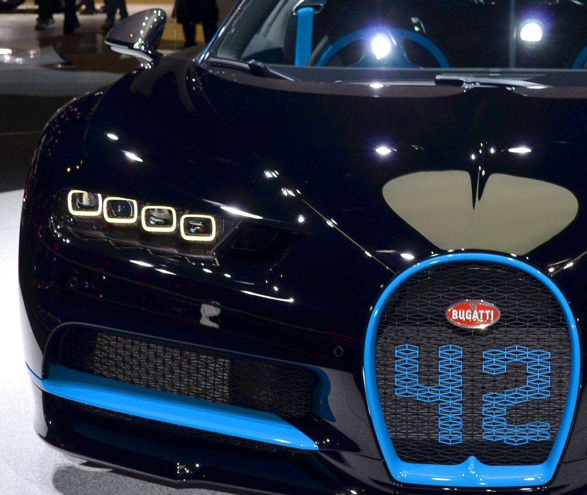 Bugatti-style quad LED headlights and blue-trimmed front grille close-up