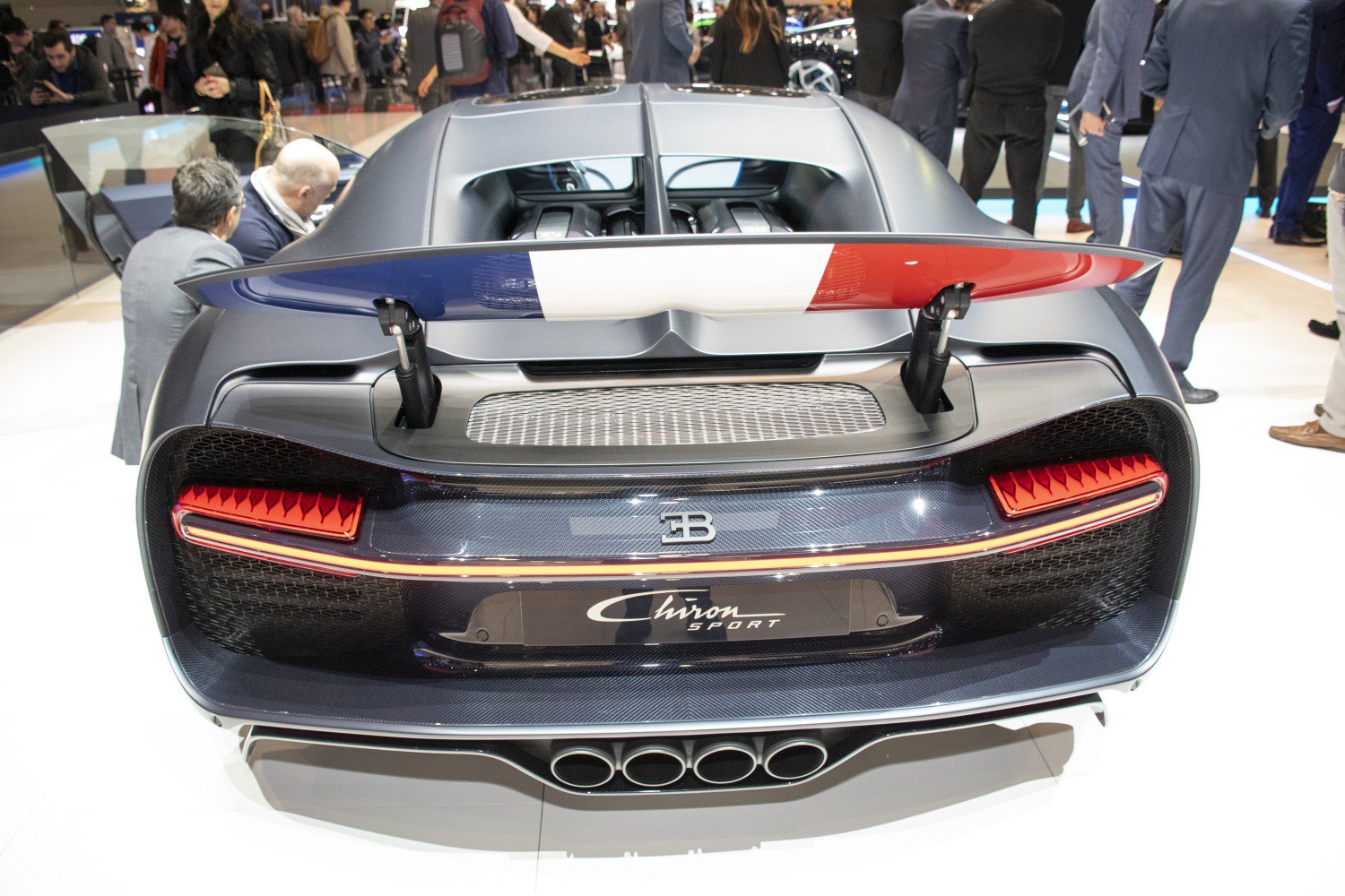 Rear of a sports car with French flag spoiler and quad exhausts