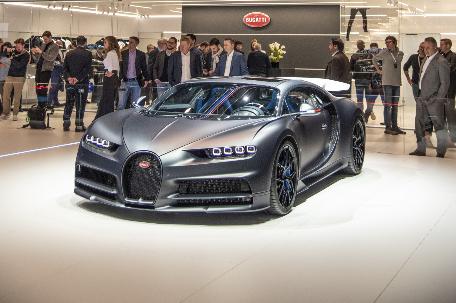 Matte black sports car front with LED headlights and aerodynamic design
