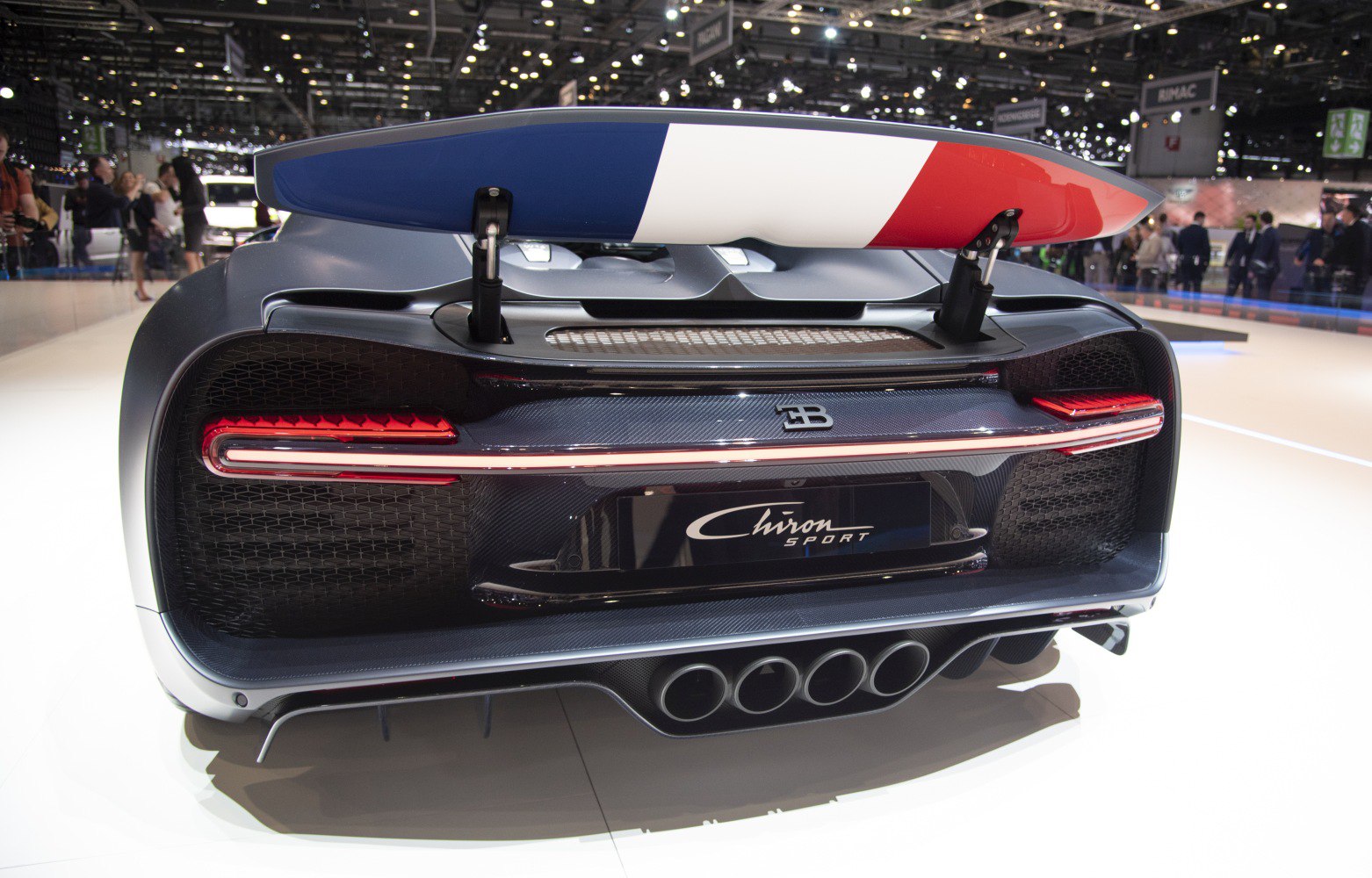 Quad exhaust with French flag rear wing and carbon fiber rear diffuser.