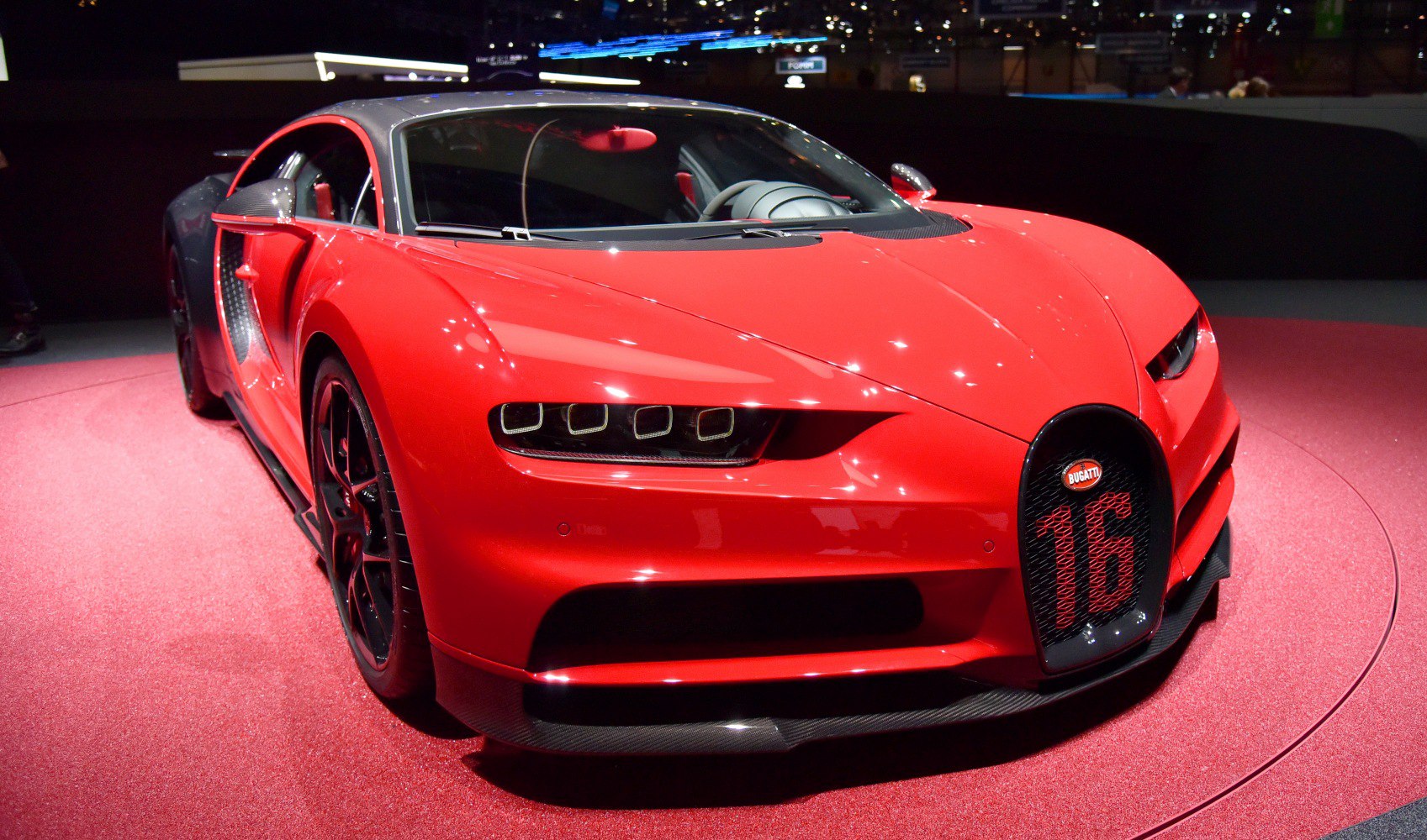 Red front view with quad LED headlights and signature grille displaying number 16