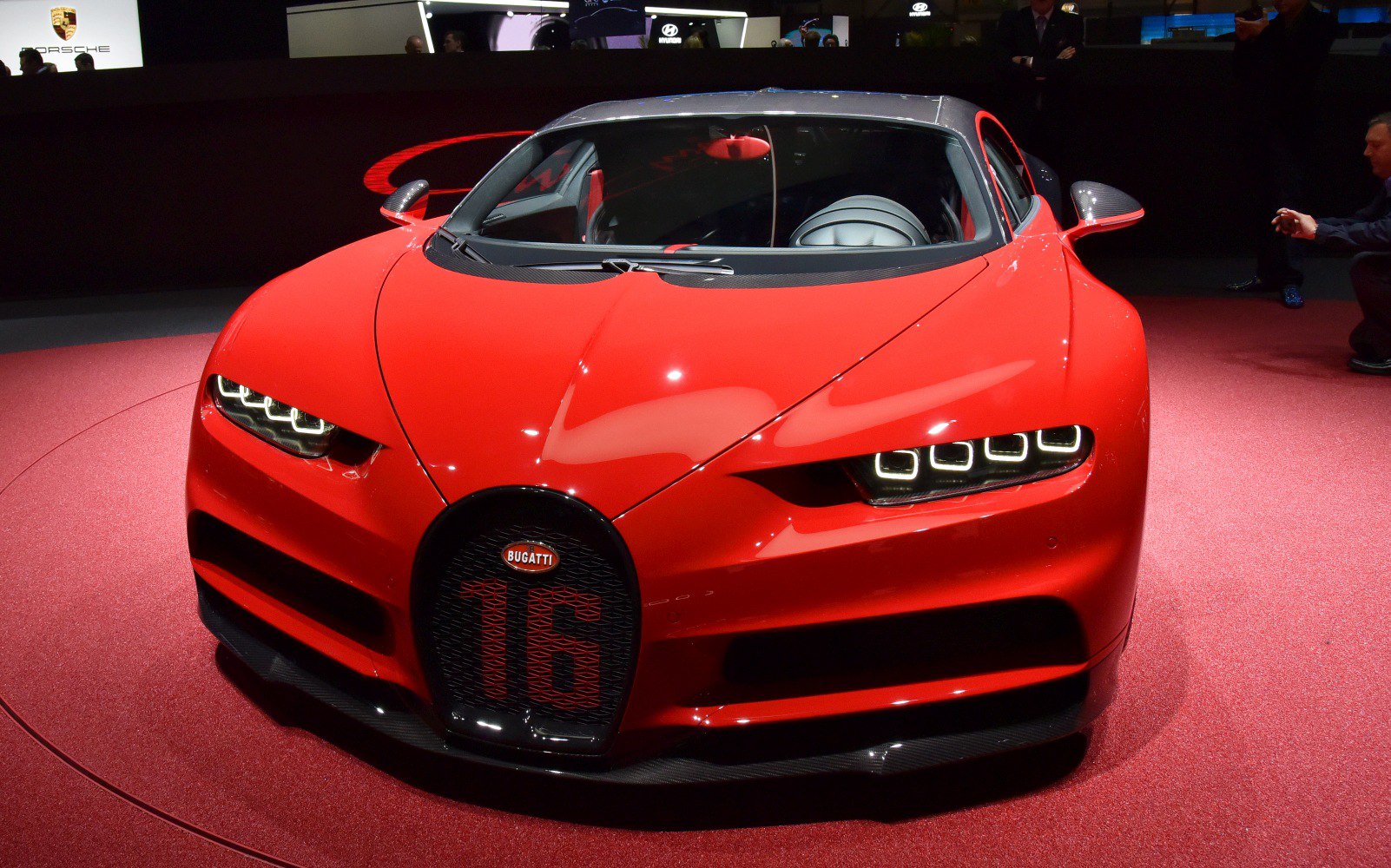 Red front view with quad LED headlights and distinctive Bugatti grille