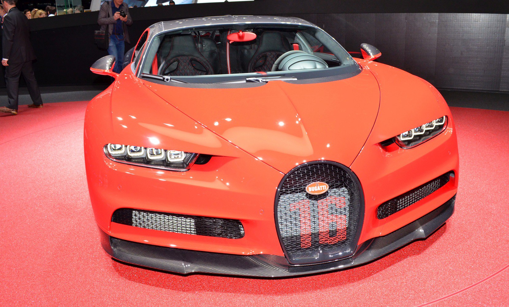 Front view with quad LED headlights and mesh grille in vivid red