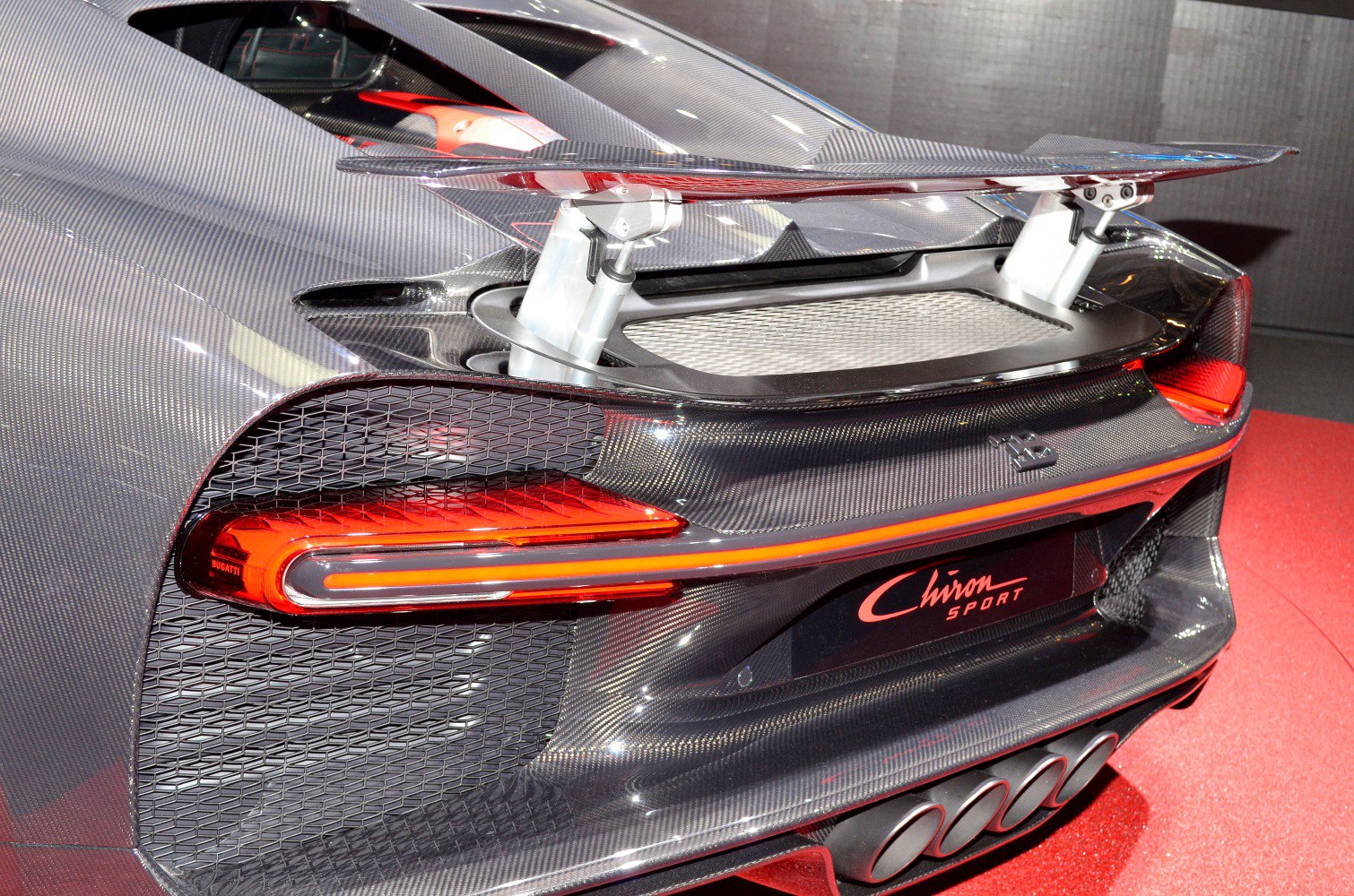 Rear view with carbon fiber body, active spoiler, and sleek taillights