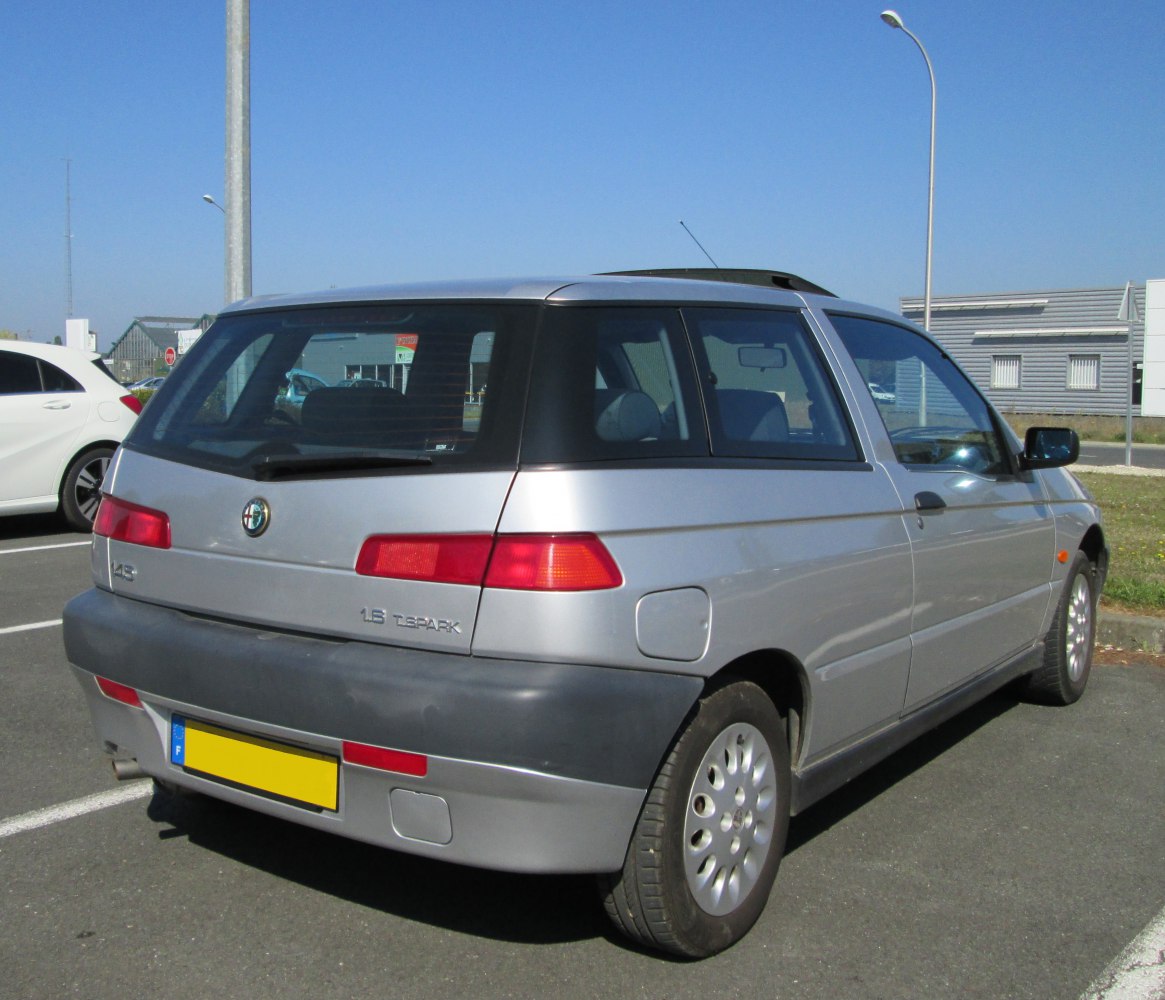 Compact hatchback rear view with distinctive taillights and rear window design