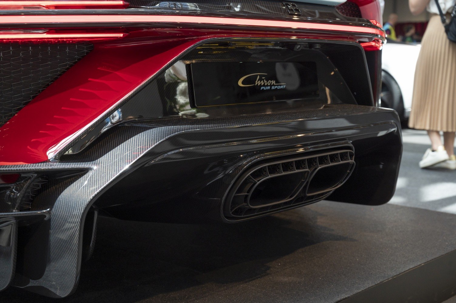 Close-up of rear diffuser and unique exhaust design with carbon fiber finish