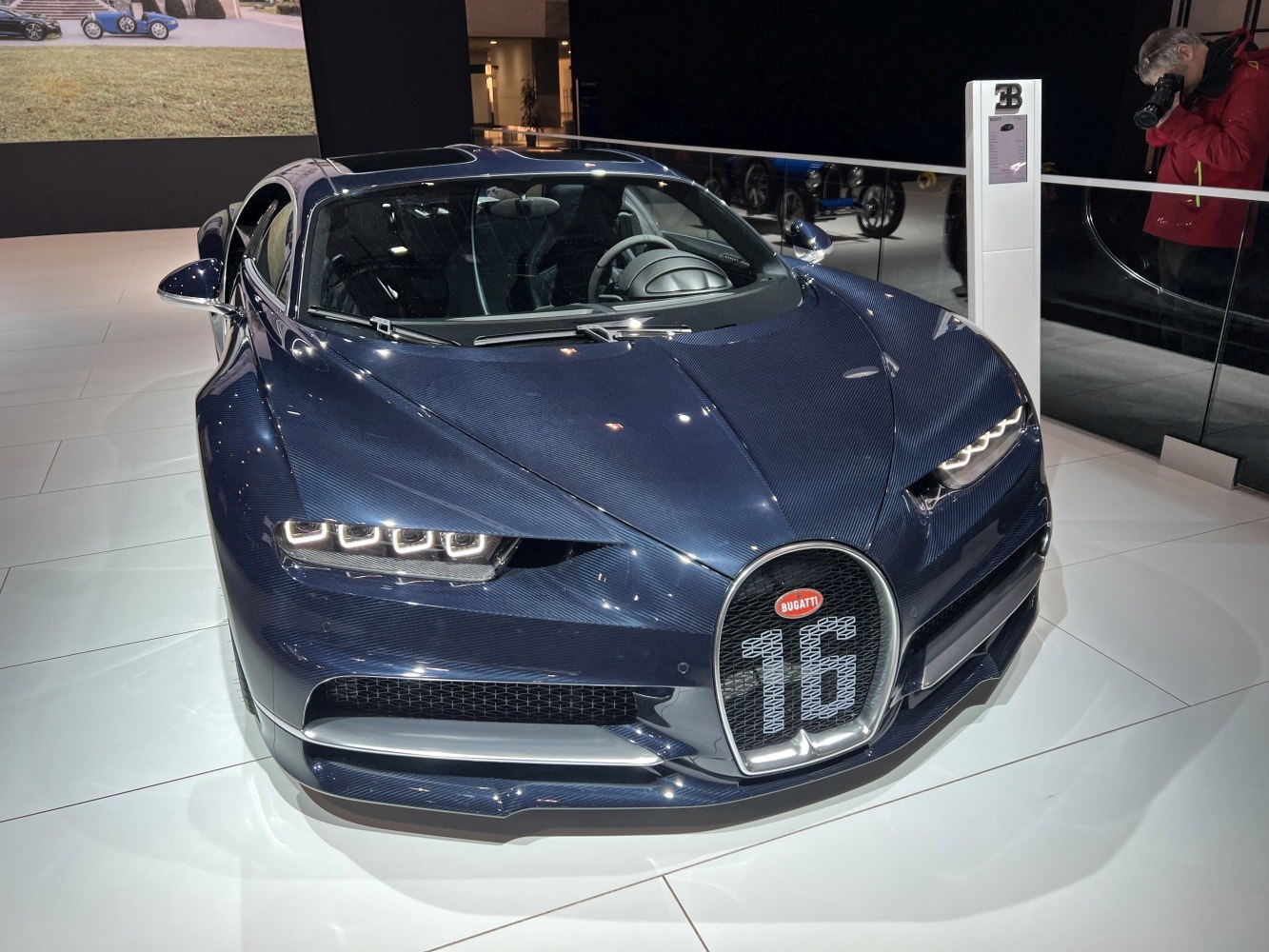 Front view showing carbon fiber body and iconic horseshoe grille with '16' badge