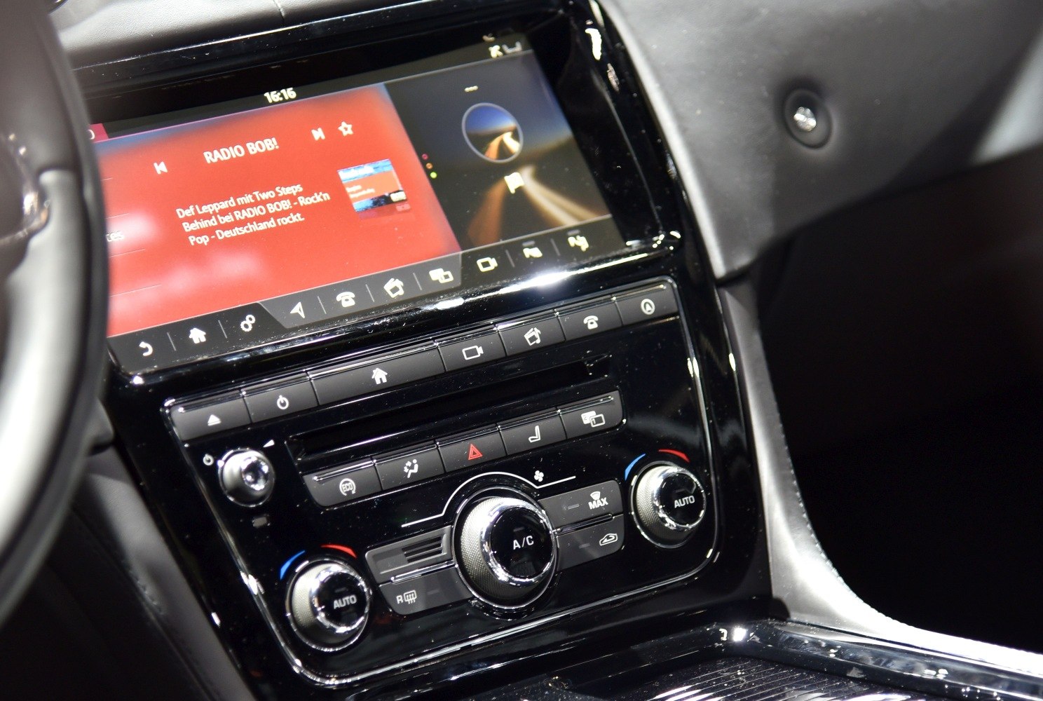 Touchscreen infotainment and climate control knobs in car center console