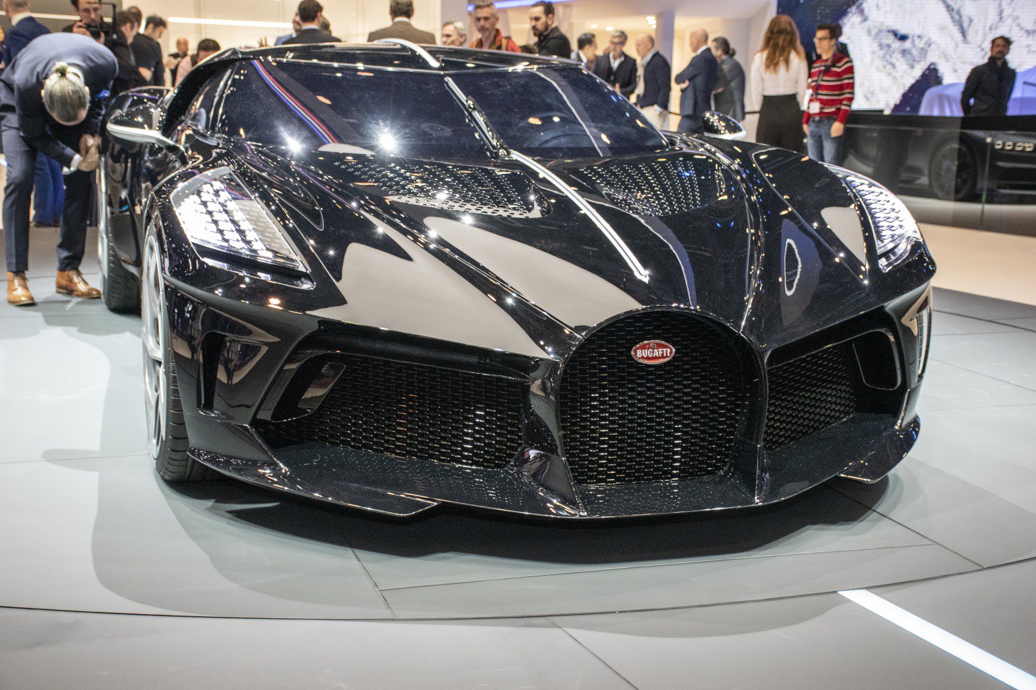 Sleek front grille and LED headlights of a luxury hypercar.