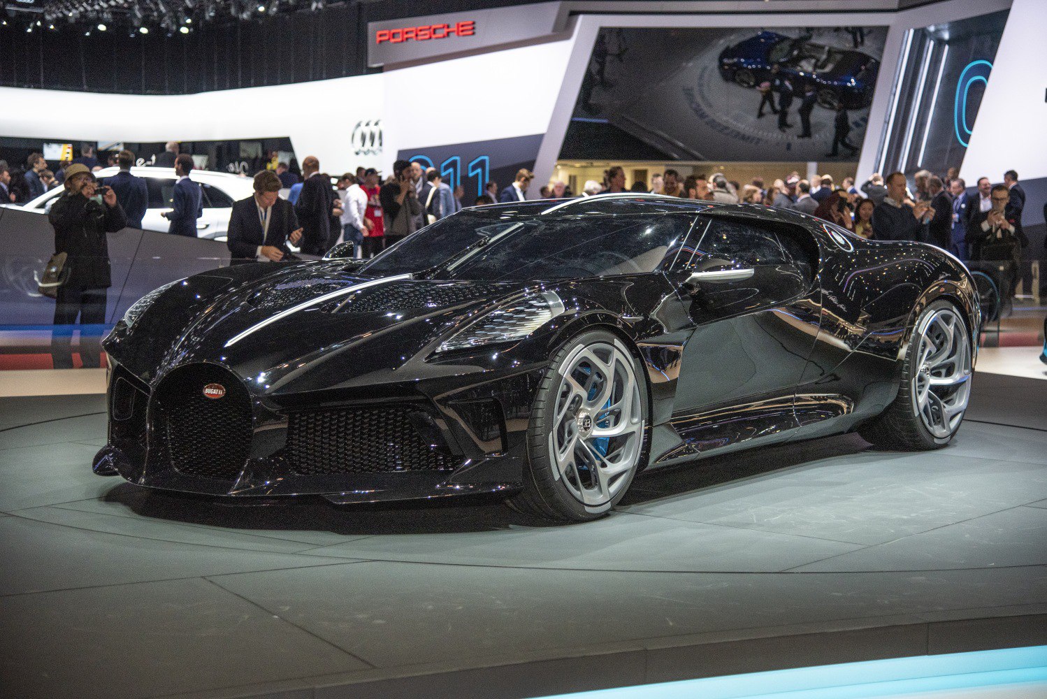 Black luxury sports coupe with aerodynamic curves and prominent grille