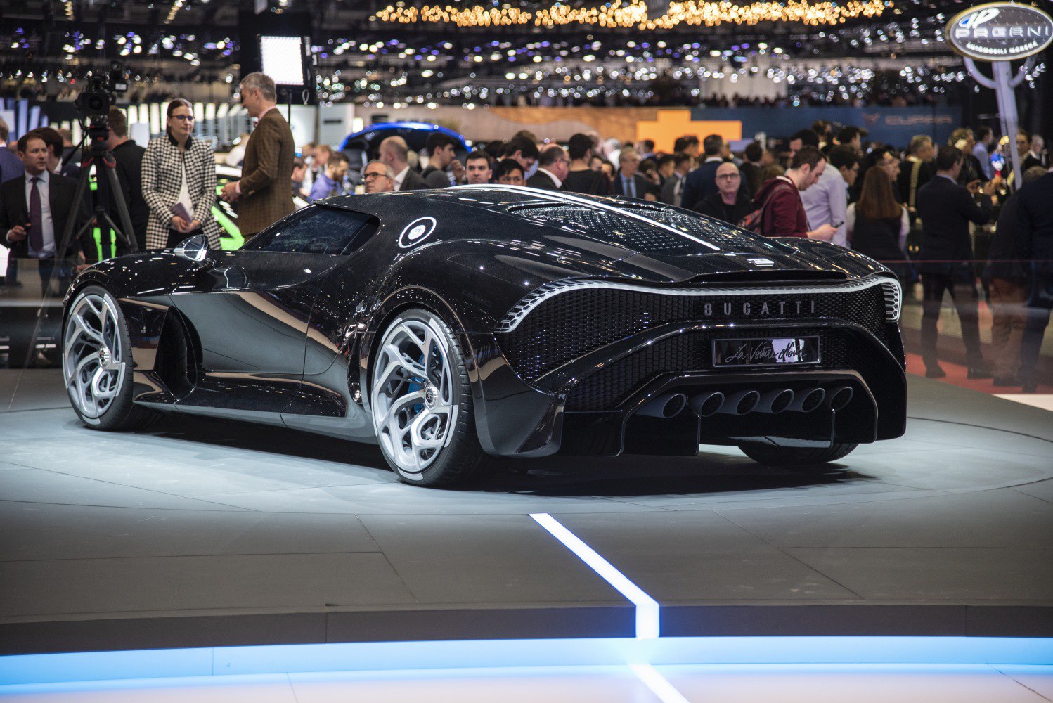 Sleek rear view of a luxury sports car with unique exhaust layout