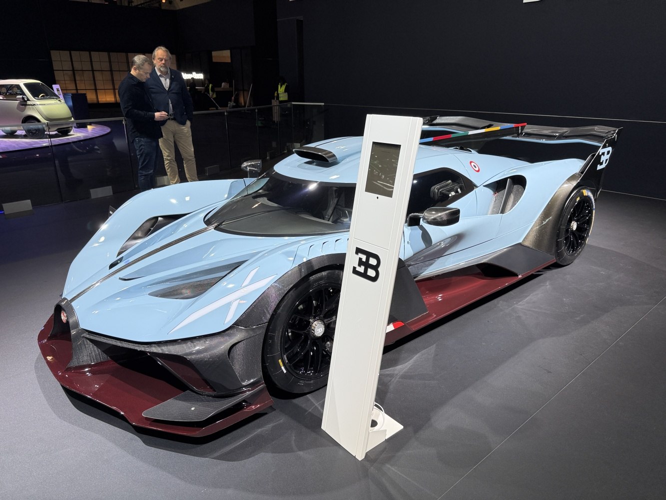 Sleek racing aerodynamics with prominent carbon fiber and aerodynamic wing