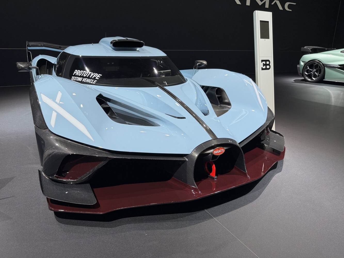 Aerodynamic front design with prototype testing vehicle badge